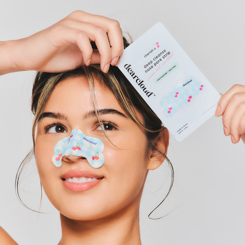 Model holding Deep Cleanse Nose Pore Strips - Cherish U overhead