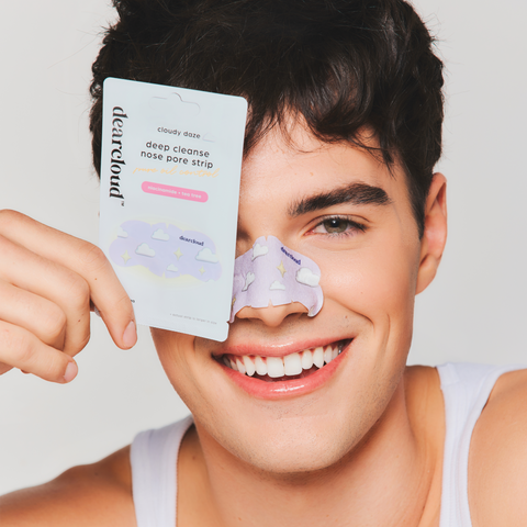 Model holding Deep Cleanse Nose Pore Strips - Cloudy Daze across face