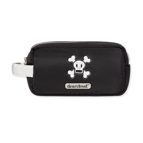  A black and white cosmetic bag featuring a skull and crossbones design, showcasing a stylish yet edgy aesthetic.