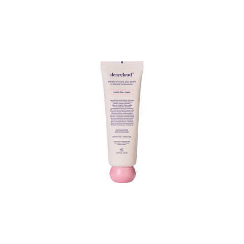 Back of tube of dearcloud hand cream with a pink spherical twist-off cap, displaying product ingredients.