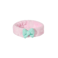 A pink and turquoise bow elegantly placed on a pink headband, showcasing a vibrant and stylish accessory.