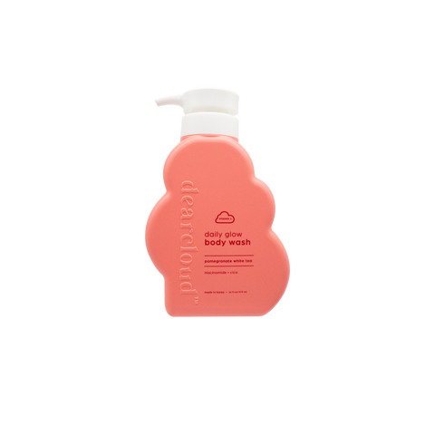 Peach-colored bottle of dearcloud Daily Glow Body Wash with a pump dispenser.